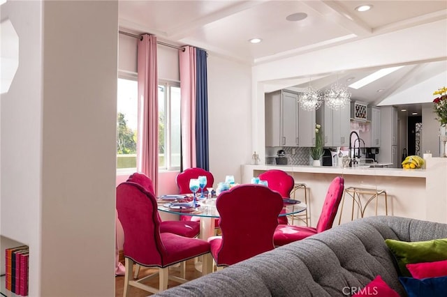 dining area with lofted ceiling with beams