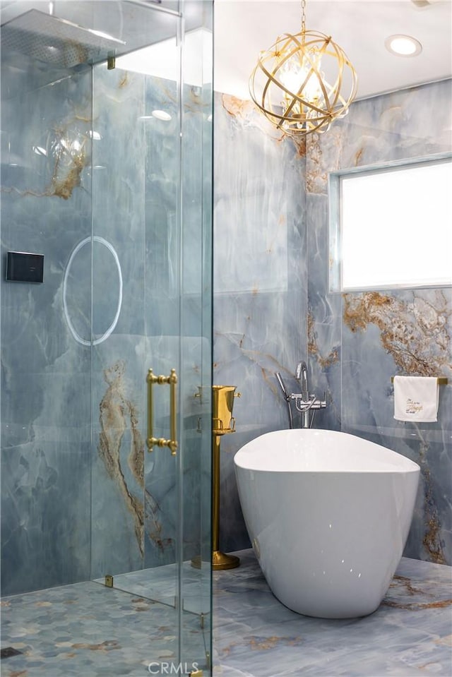 bathroom with independent shower and bath and a notable chandelier