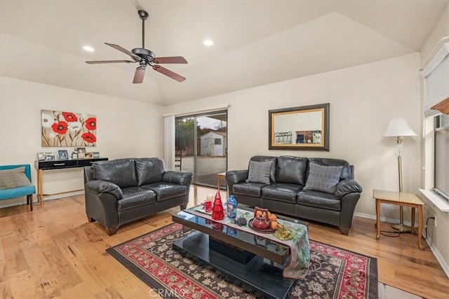 living room with ceiling fan and light hardwood / wood-style floors