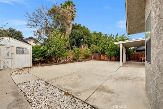 view of patio featuring a storage shed