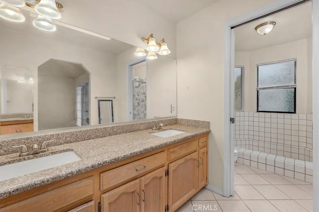 bathroom featuring vanity, tile patterned floors, and toilet