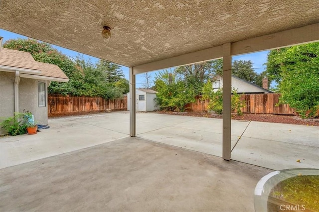 view of patio / terrace with a shed