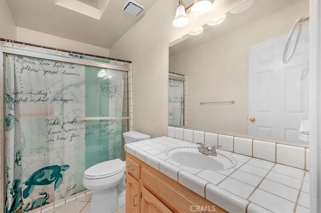 bathroom with walk in shower, vanity, toilet, and tile patterned flooring