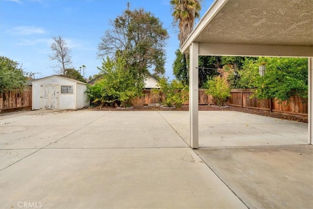 view of patio with a storage shed