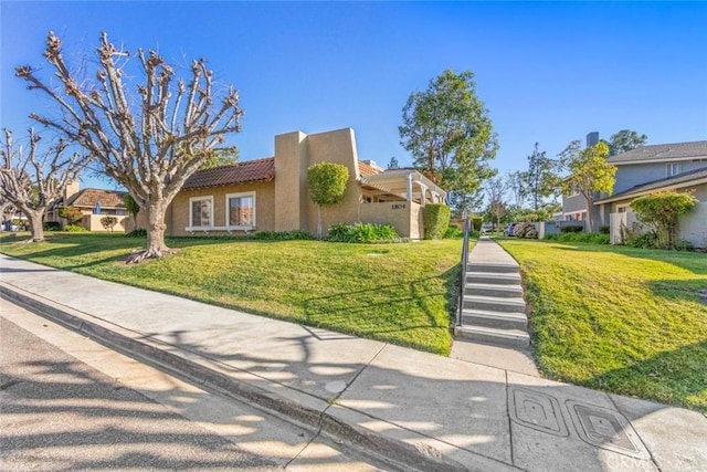 view of front of home with a front lawn