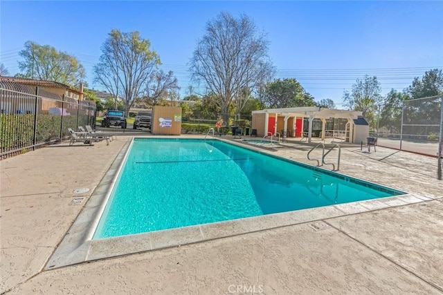 view of swimming pool with a patio area