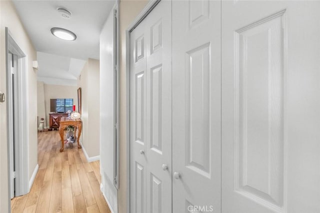 hall with light hardwood / wood-style flooring