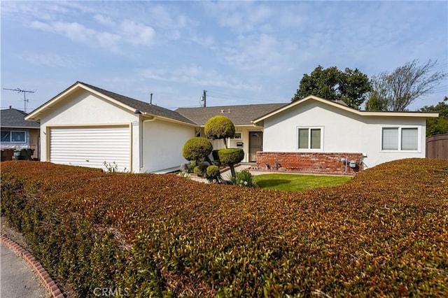 ranch-style home featuring a garage