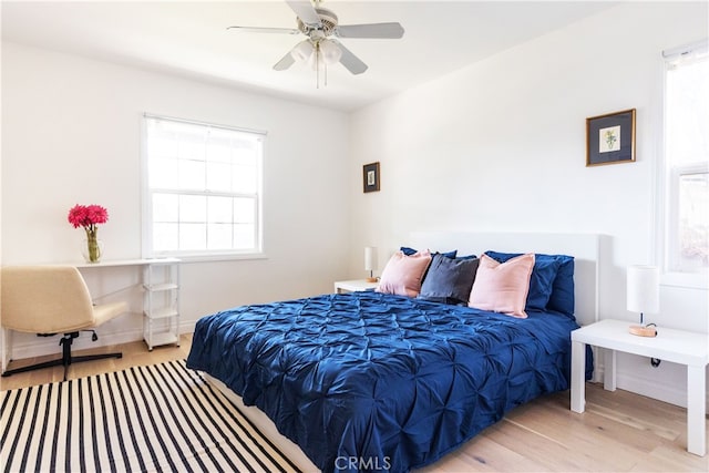 bedroom featuring ceiling fan and light wood-type flooring