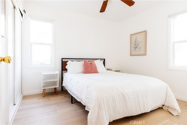 bedroom featuring ceiling fan and light hardwood / wood-style floors