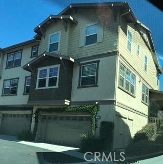 exterior space with a garage and stucco siding