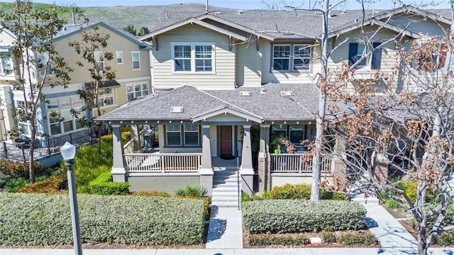 22 Arlington St, Ladera Ranch, CA 92694 - view of front facade with covered porch, a shingled roof, and stairs