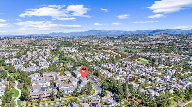 drone / aerial view with a residential view and a mountain view