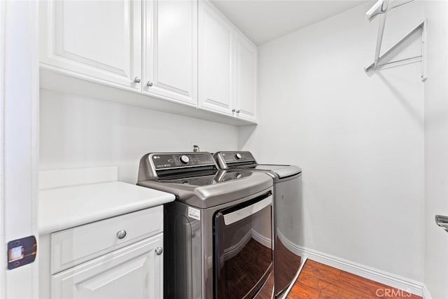 22 Arlington St, Ladera Ranch, CA 92694 - laundry area with separate washer and dryer, cabinet space, and wood finished floors