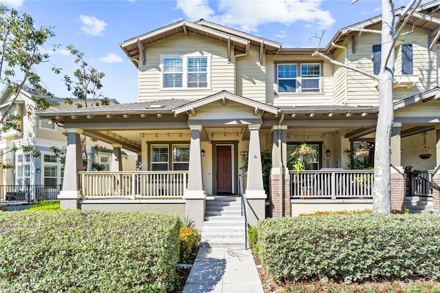 craftsman inspired home featuring covered porch