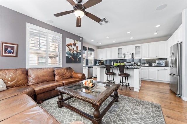 22 Arlington St, Ladera Ranch, CA 92694 - living room featuring light wood finished floors, a ceiling fan, plenty of natural light, and recessed lighting