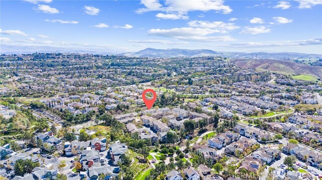 aerial view featuring a mountain view and a residential view