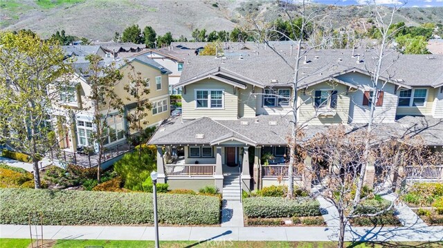 view of front of house with a porch and a mountain view