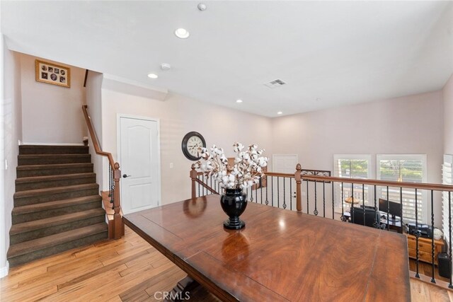 dining room featuring light wood-style floors, recessed lighting, and visible vents
