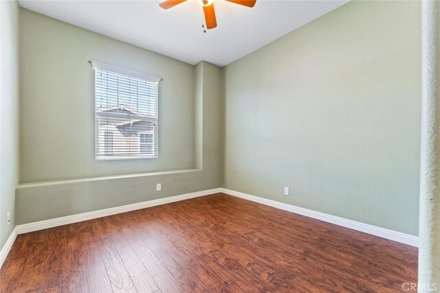 22 Arlington St, Ladera Ranch, CA 92694 - empty room with dark wood-style flooring, ceiling fan, baseboards, and vaulted ceiling
