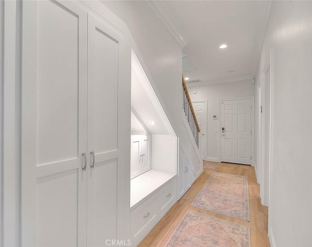 bathroom with hardwood / wood-style floors and crown molding