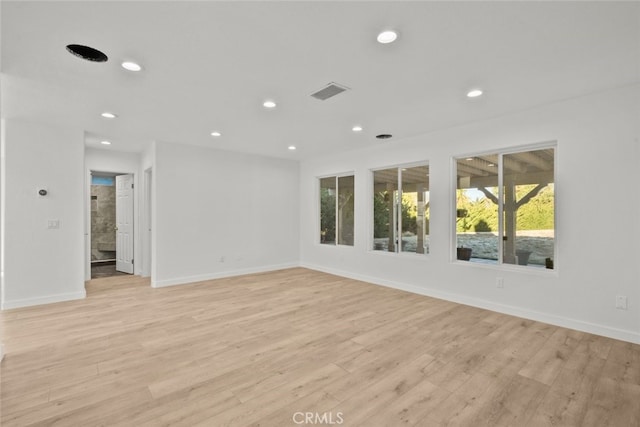 spare room with light hardwood / wood-style flooring