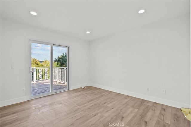 unfurnished room with light hardwood / wood-style floors