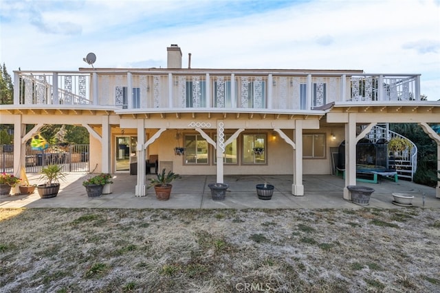 rear view of house featuring a patio area