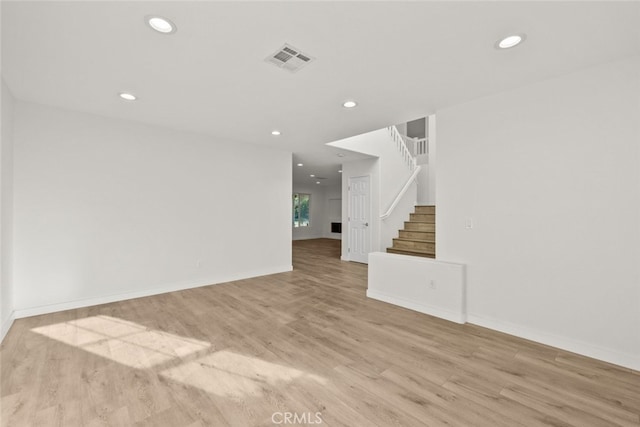 unfurnished living room with light wood-type flooring