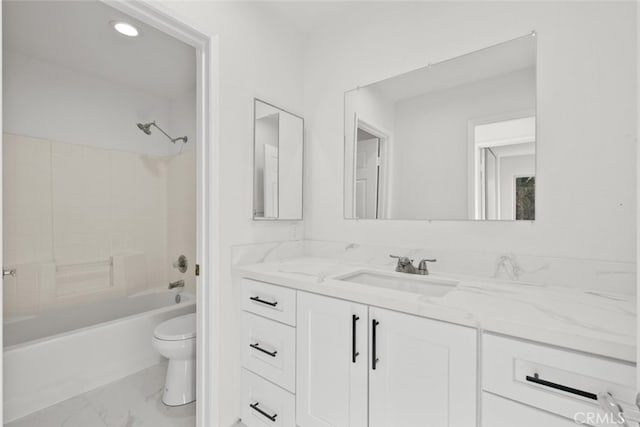 bathroom with toilet, marble finish floor, shower / washtub combination, and vanity