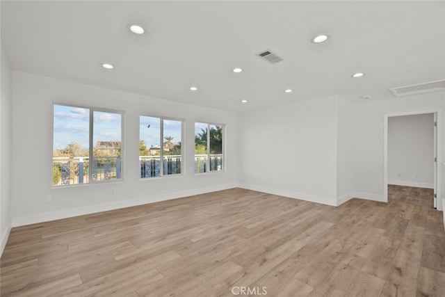 spare room featuring light hardwood / wood-style floors