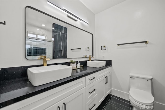 bathroom featuring walk in shower, vanity, and toilet