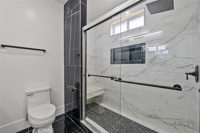 bathroom with toilet and an enclosed shower