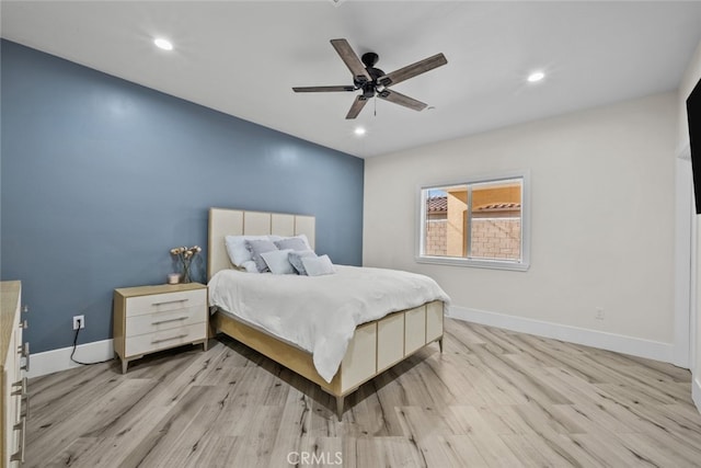 bedroom with light hardwood / wood-style flooring and ceiling fan