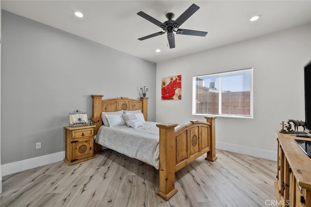 bedroom with ceiling fan and light wood-type flooring