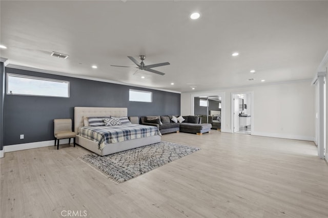 bedroom featuring ornamental molding, ceiling fan, and light hardwood / wood-style flooring