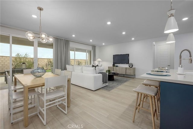 dining space with light hardwood / wood-style flooring