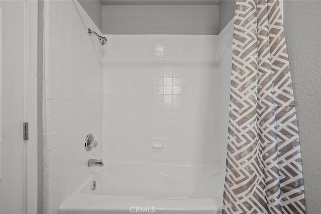 bathroom with shower / tub combo with curtain