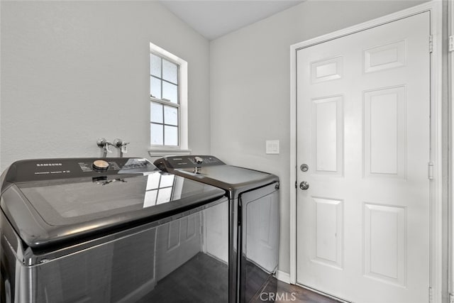 clothes washing area featuring washer and dryer