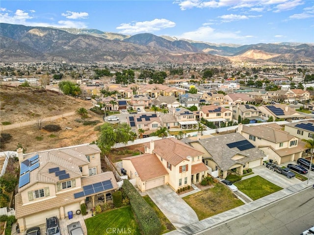 birds eye view of property with a mountain view