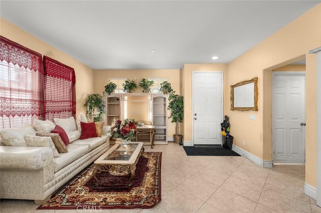 living room featuring plenty of natural light and light tile patterned flooring