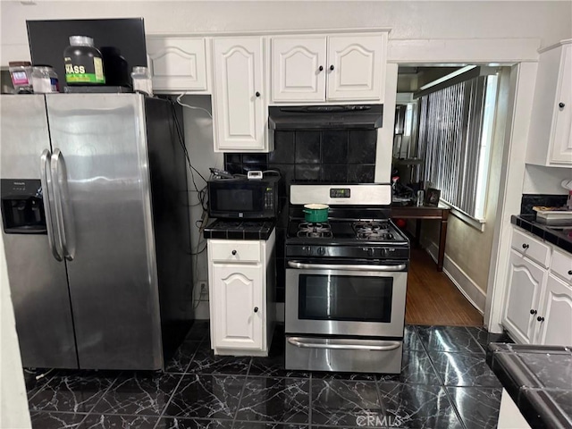 kitchen with stainless steel appliances and white cabinets