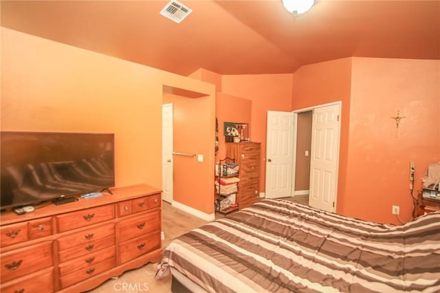 bedroom with lofted ceiling