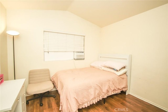 bedroom with dark wood-type flooring and vaulted ceiling