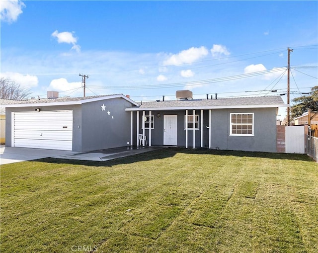 ranch-style home with a garage and a front lawn