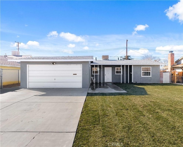 ranch-style home featuring a garage and a front yard