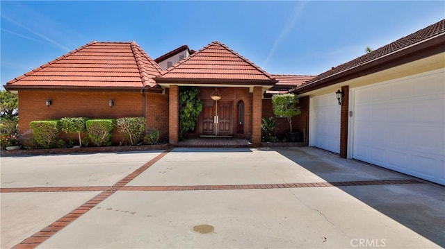 mediterranean / spanish-style house featuring a garage