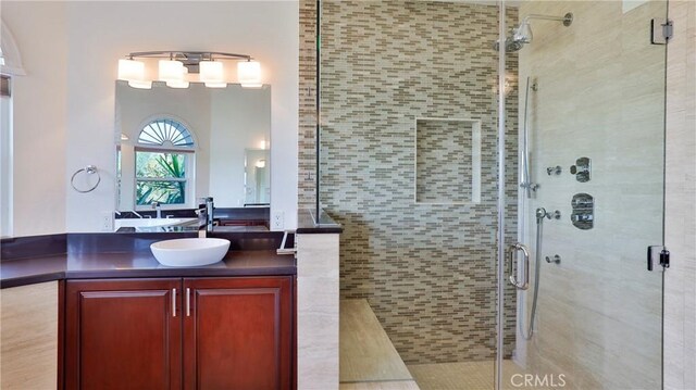 bathroom featuring vanity and walk in shower