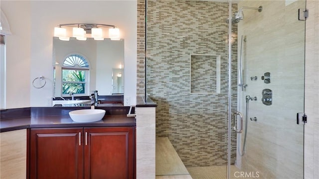 full bath featuring a stall shower and vanity