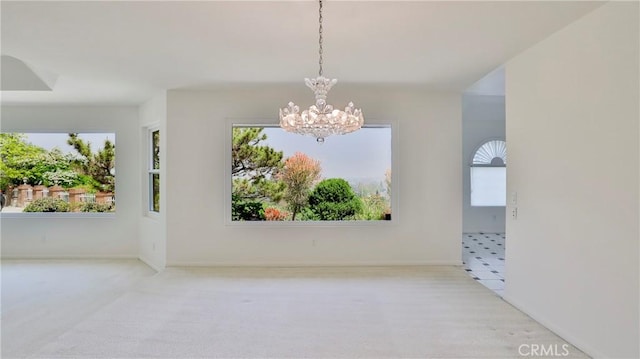 empty room featuring a notable chandelier